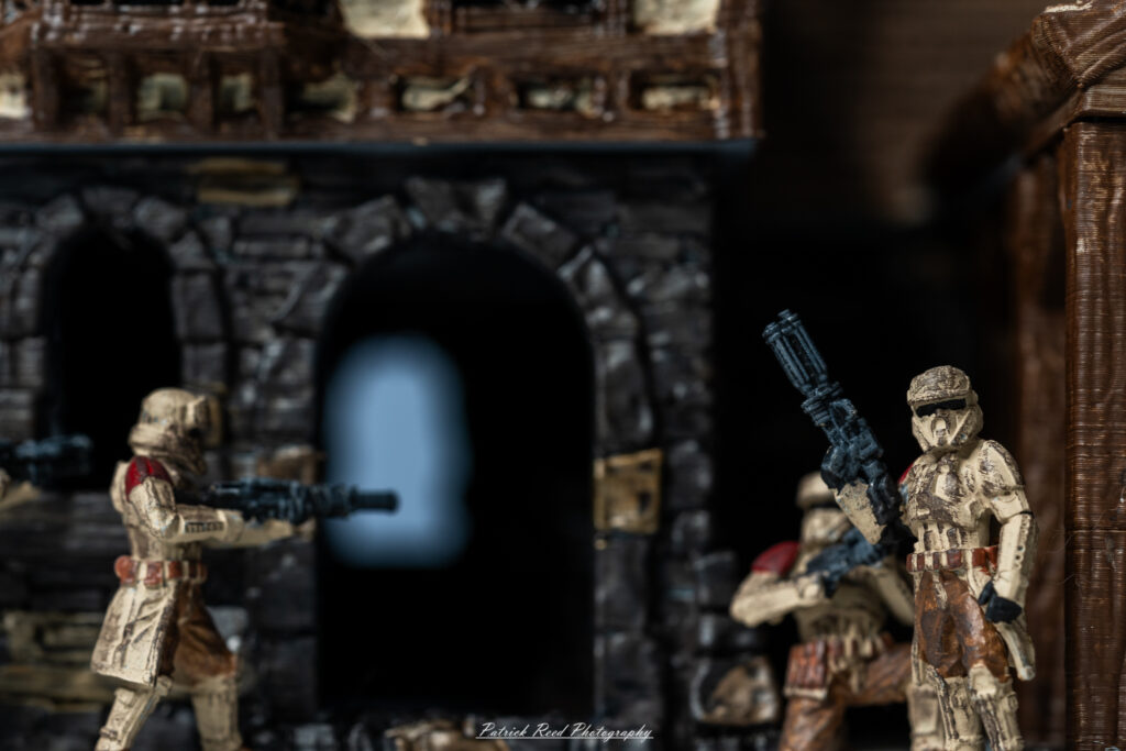 "Shoretroopers storming into a Dungeons & Dragons tavern, their armor contrasting with the rustic decor of the establishment. The tavern is bustling with patrons, who look on in surprise and fear as the troopers burst through the door. Wooden tables, flickering candlelight, and various fantasy characters fill the background, creating a chaotic yet vibrant scene of unexpected adventure and confrontation."