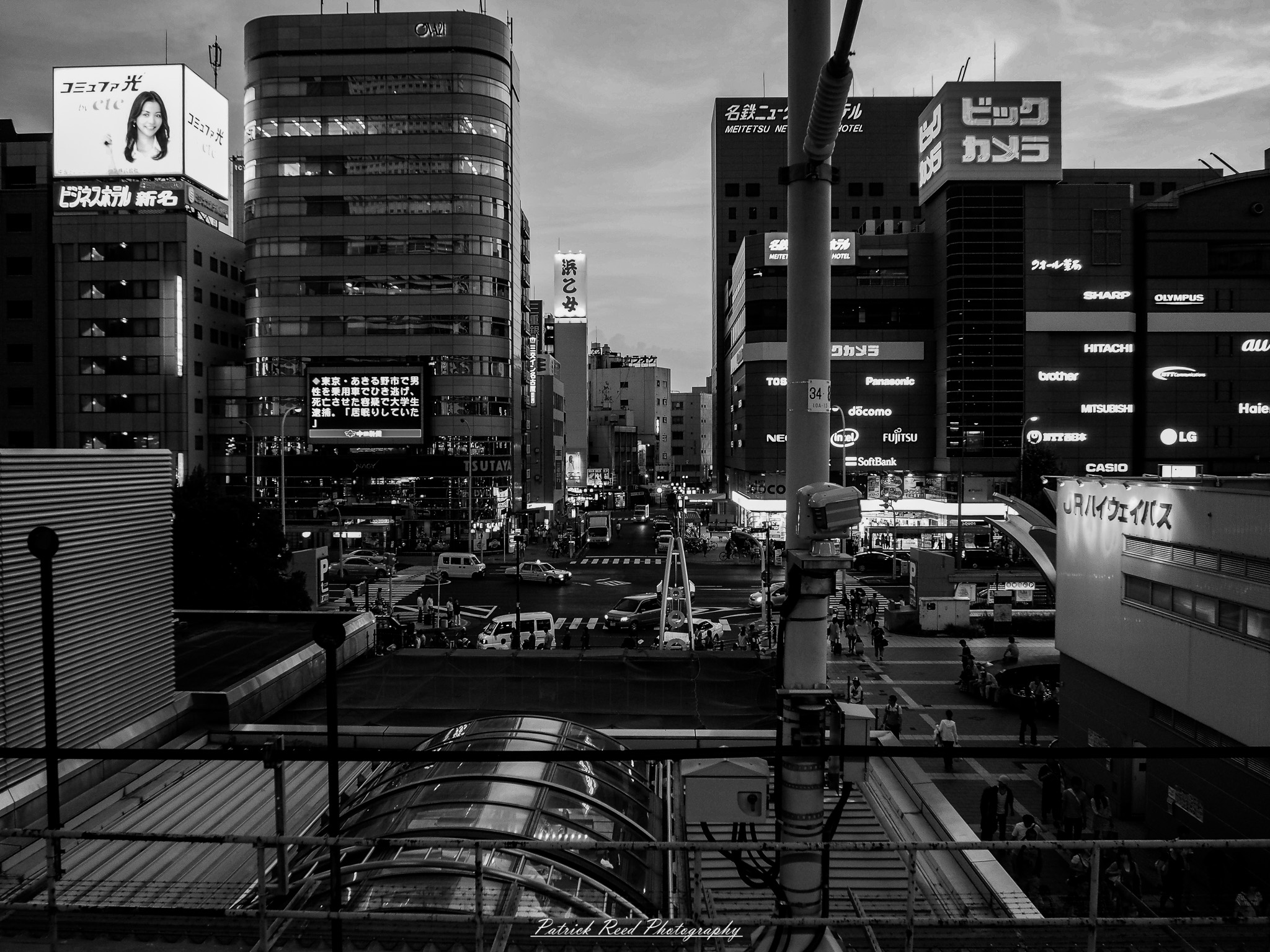 A series of noir-style street photography scenes set in Hiroshima, Japan, at night. The rain-slicked streets and narrow alleys reflect the soft glow of neon signs from izakayas, small shops, and vending machines. Silhouettes of people walking under umbrellas move through the misty atmosphere, their shadows stretching across the pavement. Traditional Japanese architecture, such as wooden facades and noren curtains, blends with modern urban elements like glowing billboards and bicycles parked along dimly lit sidewalks. The moody lighting, deep contrasts, and quiet yet cinematic ambiance evoke a sense of mystery and nostalgia, capturing the noir aesthetic in a contemporary Japanese cityscape.