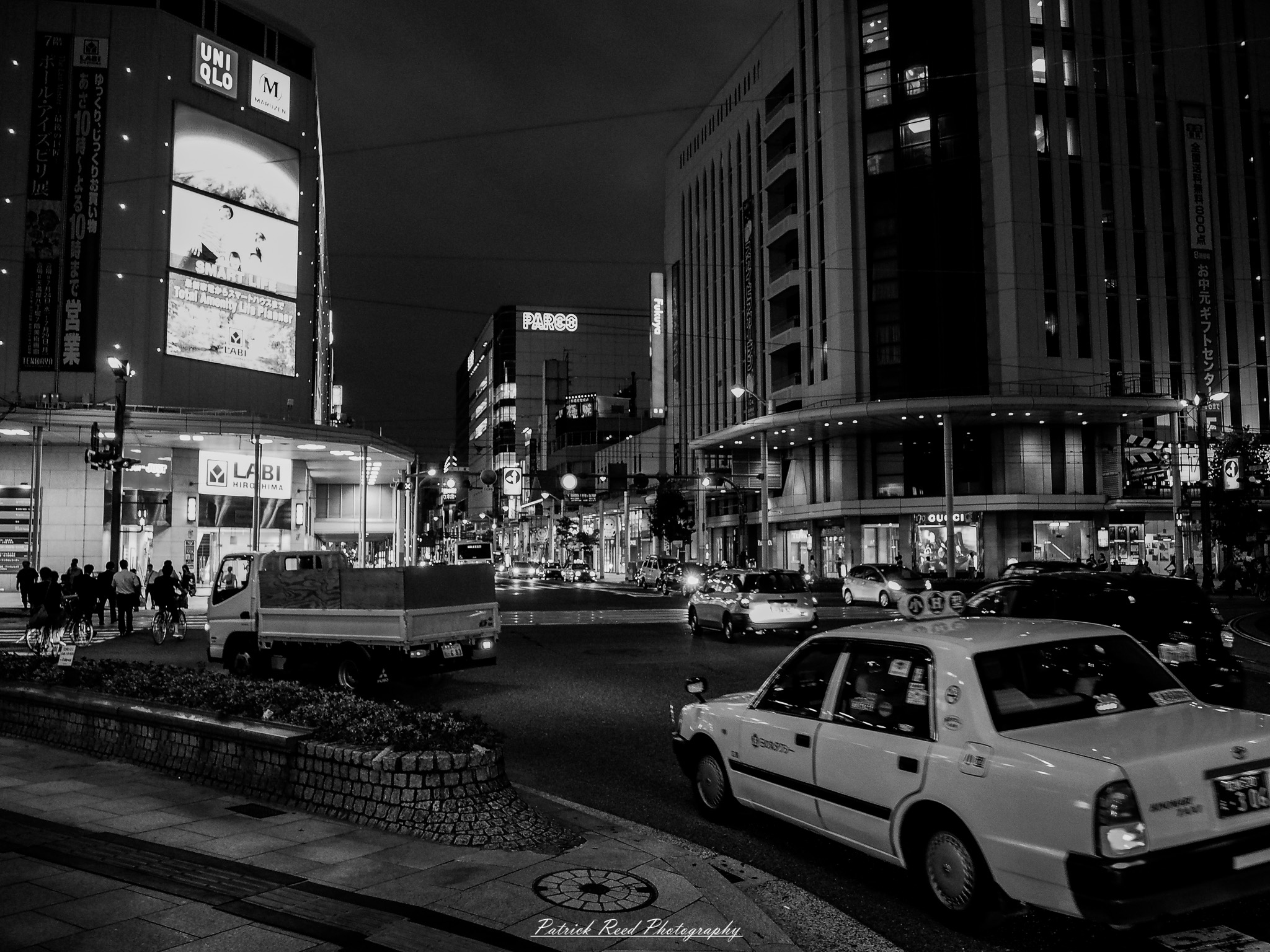 A series of noir-style street photography scenes set in Hiroshima, Japan, at night. The rain-slicked streets and narrow alleys reflect the soft glow of neon signs from izakayas, small shops, and vending machines. Silhouettes of people walking under umbrellas move through the misty atmosphere, their shadows stretching across the pavement. Traditional Japanese architecture, such as wooden facades and noren curtains, blends with modern urban elements like glowing billboards and bicycles parked along dimly lit sidewalks. The moody lighting, deep contrasts, and quiet yet cinematic ambiance evoke a sense of mystery and nostalgia, capturing the noir aesthetic in a contemporary Japanese cityscape.