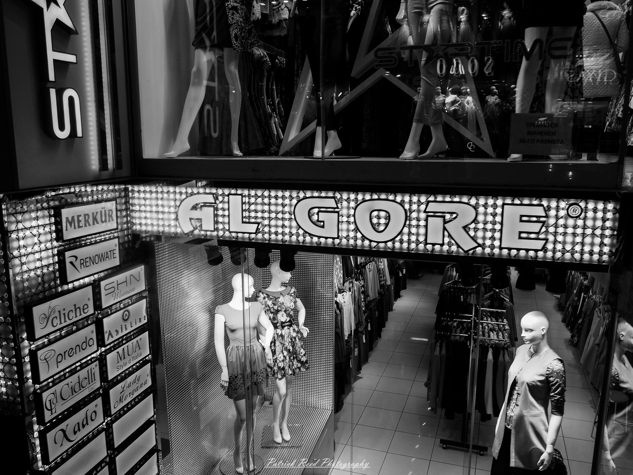 Turkey 17 A series of noir-style street photography scenes set in Istanbul, Turkey, at night. The dimly lit streets and narrow alleys are wet from rain, reflecting the warm glow of streetlights and neon signs. Silhouettes of people walking, some carrying umbrellas, move through the misty atmosphere. The scenes highlight a blend of historical Ottoman architecture, such as arched doorways and intricate stone facades, with modern urban elements like cafes, storefronts, and graffiti. The Bosphorus skyline and glimpses of minarets in the distance add to the cinematic, mysterious ambiance. The overall mood is evocative and steeped in noir storytelling.