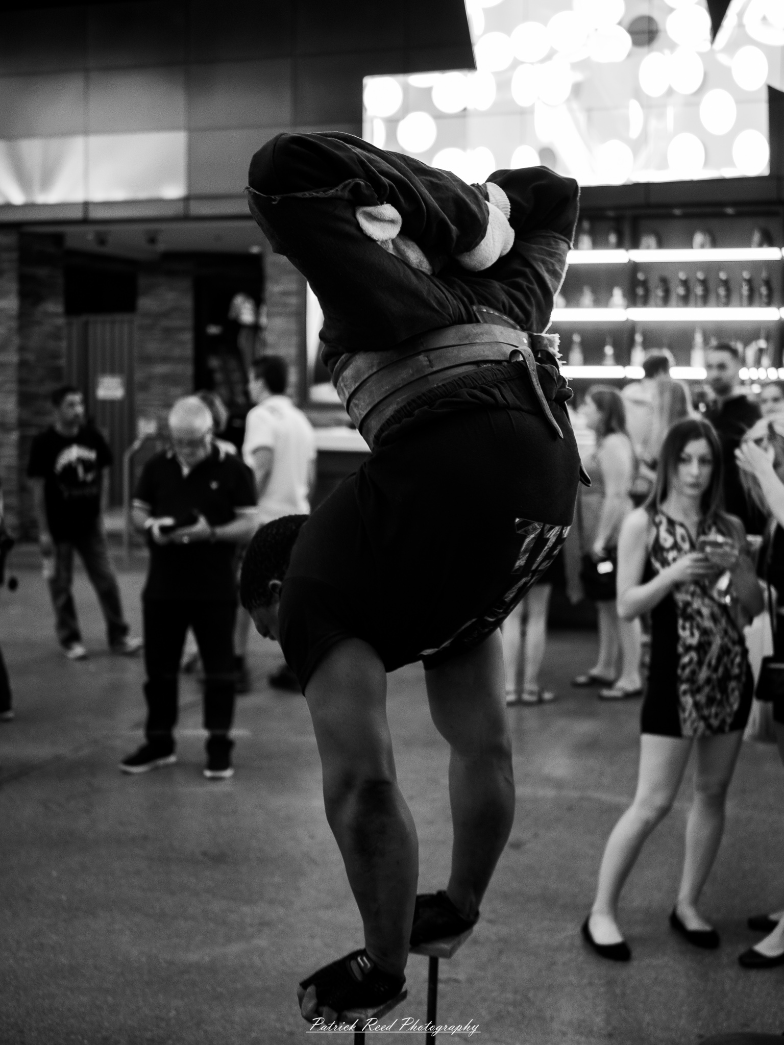 Vegas 24 A series of noir-style street photography scenes set in Las Vegas, Nevada, at night. The rain-slicked streets reflect the vibrant glow of neon signs from casinos, motels, and diners. Silhouettes of people walking under umbrellas or leaning against lampposts add a sense of mystery and intrigue. The scenes capture a mix of classic Vegas landmarks, vintage signage, and gritty back alleys with graffiti and scattered debris. The dramatic lighting emphasizes shadows and contrasts, creating a moody, cinematic ambiance that evokes the essence of noir storytelling in a bustling yet shadowy cityscape.