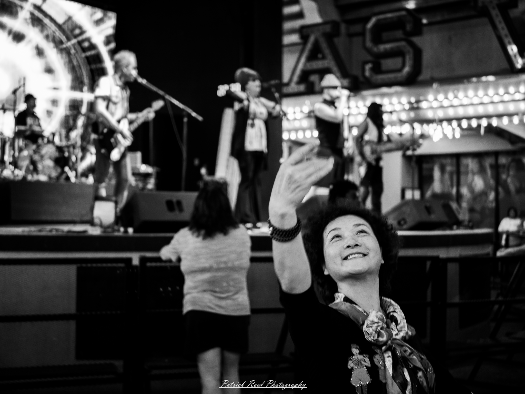 Vegas 28 A series of noir-style street photography scenes set in Las Vegas, Nevada, at night. The rain-slicked streets reflect the vibrant glow of neon signs from casinos, motels, and diners. Silhouettes of people walking under umbrellas or leaning against lampposts add a sense of mystery and intrigue. The scenes capture a mix of classic Vegas landmarks, vintage signage, and gritty back alleys with graffiti and scattered debris. The dramatic lighting emphasizes shadows and contrasts, creating a moody, cinematic ambiance that evokes the essence of noir storytelling in a bustling yet shadowy cityscape.