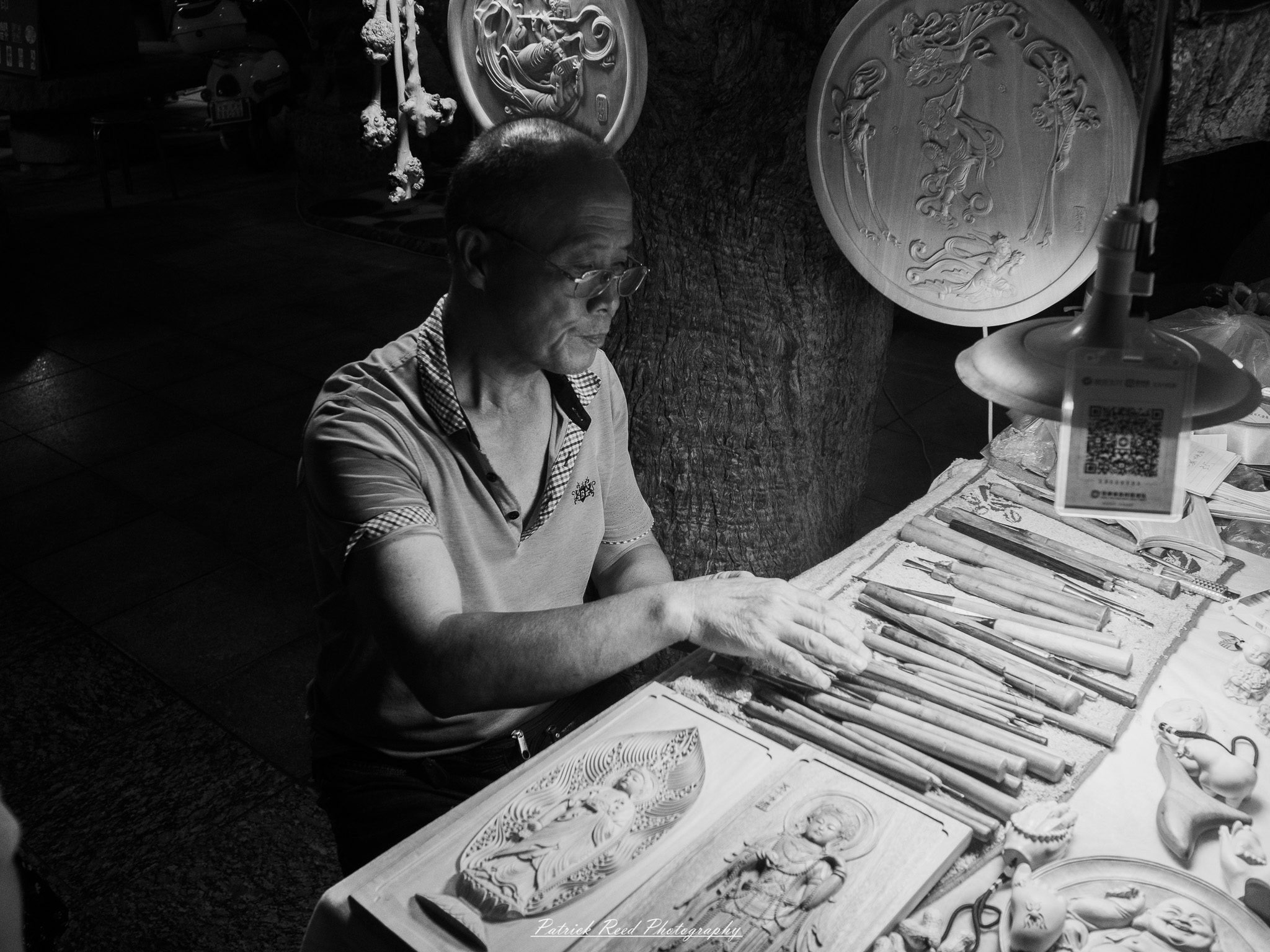 A series of noir-style street photography scenes set in Dunhuang, China, at night. The dimly lit streets and narrow alleyways reflect the soft glow of lanterns and neon signs from small shops and market stalls. Silhouettes of people walk through the misty night, some in traditional robes, adding a sense of mystery. The historic Silk Road atmosphere is highlighted by earthen architecture, intricate wooden doors, and desert dust settling on the pavement. Modern elements like motorbikes and distant headlights contrast with the ancient setting. The deep shadows and warm, flickering lights create a cinematic, moody ambiance, blending noir aesthetics with Dunhuang’s rich cultural history.