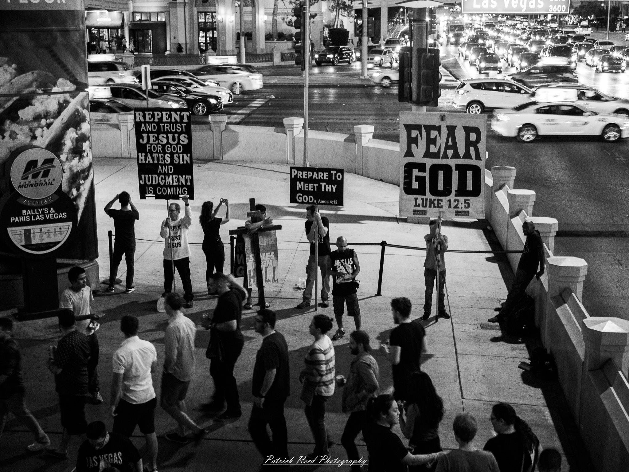 Vegas 40 A series of noir-style street photography scenes set in Las Vegas, Nevada, at night. The rain-slicked streets reflect the vibrant glow of neon signs from casinos, motels, and diners. Silhouettes of people walking under umbrellas or leaning against lampposts add a sense of mystery and intrigue. The scenes capture a mix of classic Vegas landmarks, vintage signage, and gritty back alleys with graffiti and scattered debris. The dramatic lighting emphasizes shadows and contrasts, creating a moody, cinematic ambiance that evokes the essence of noir storytelling in a bustling yet shadowy cityscape.