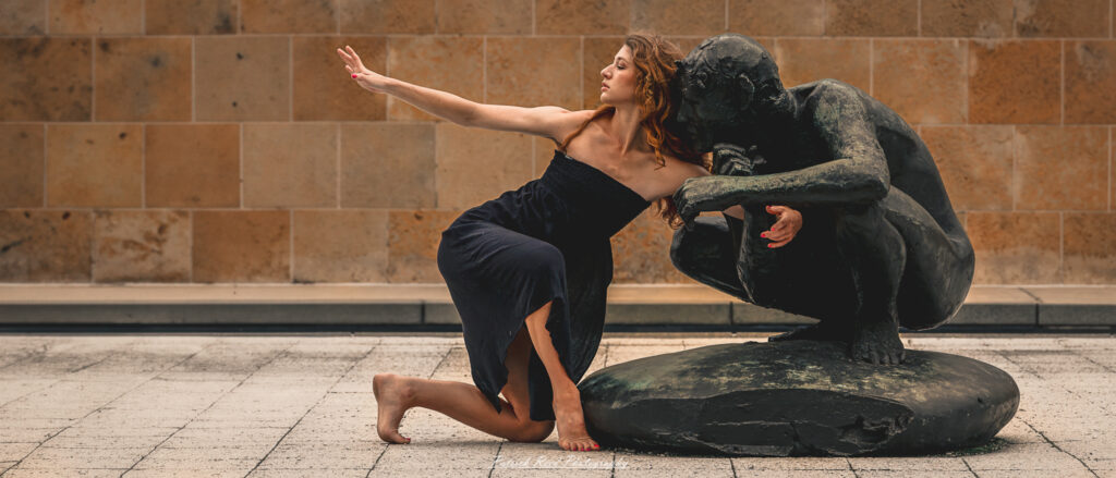 Portrait of a dancer captured on July 20, 2025, performing a graceful pose on the Wayne State University campus in Detroit.