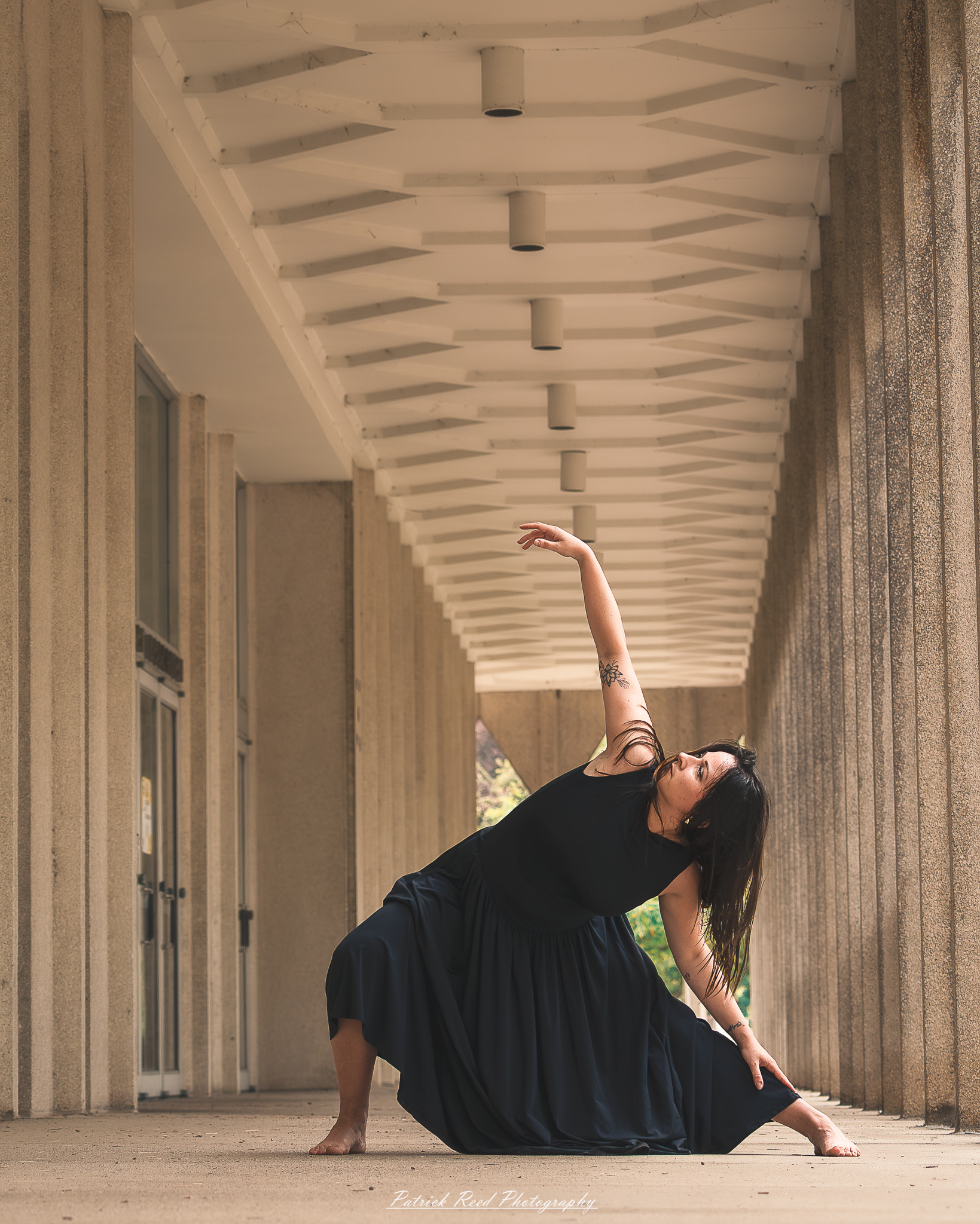Portrait of a dancer captured on July 20, 2025, performing a graceful pose on the Wayne State University campus in Detroit.