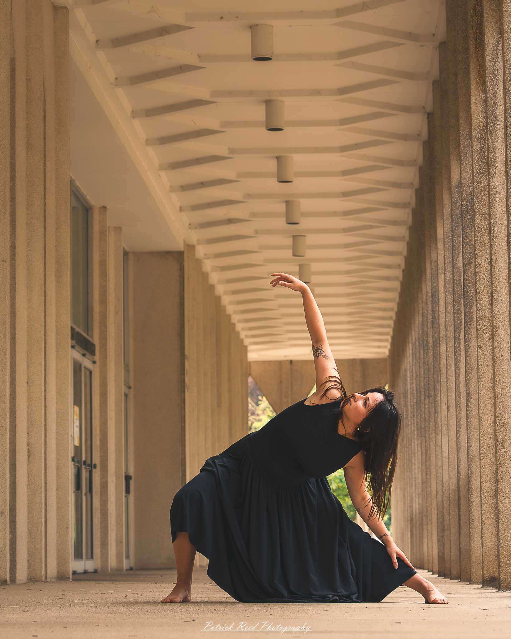 Portrait of a dancer captured on July 20, 2025, performing a graceful pose on the Wayne State University campus in Detroit.