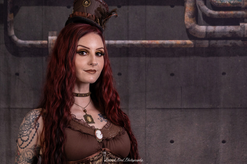 Portrait of a steampunk model named Minerva, taken on July 9, 2025. She is dressed in vintage-inspired futuristic attire with detailed accessories, capturing the essence of steampunk fashion.