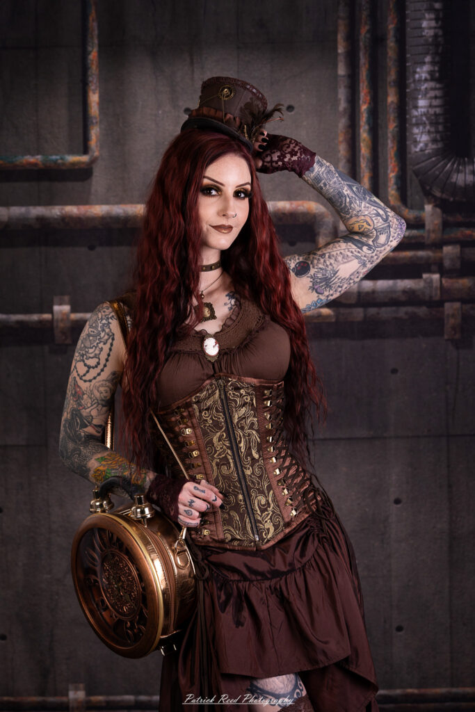 Portrait of a steampunk model named Minerva, taken on July 9, 2025. She is dressed in vintage-inspired futuristic attire with detailed accessories, capturing the essence of steampunk fashion.