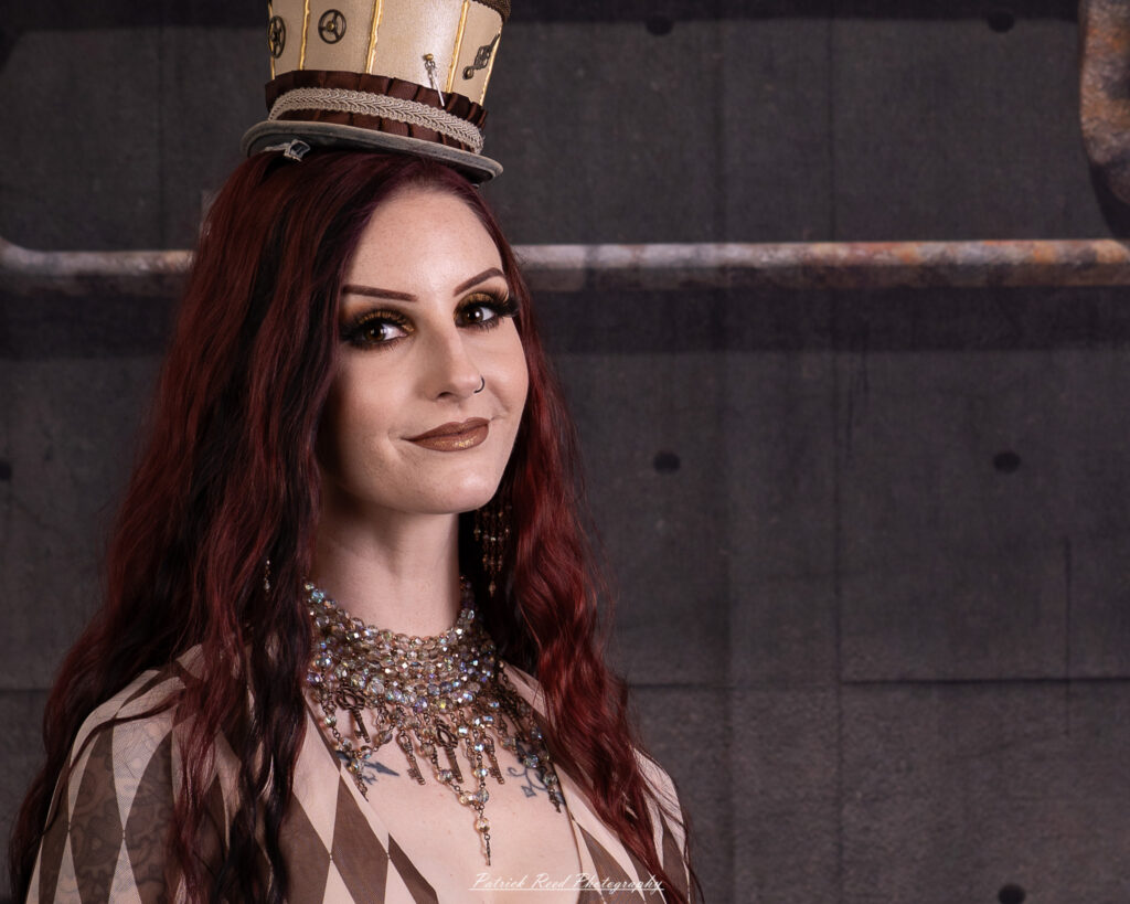 Portrait of a steampunk model named Minerva, taken on July 9, 2025. She is dressed in vintage-inspired futuristic attire with detailed accessories, capturing the essence of steampunk fashion.