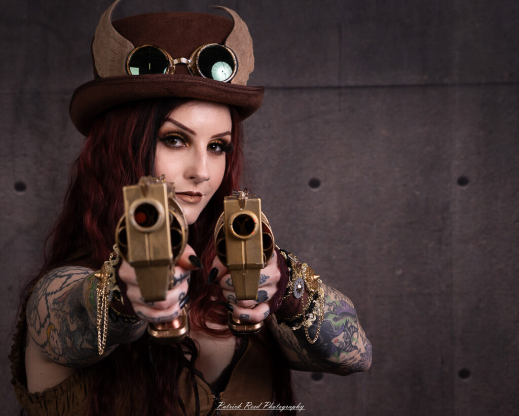 Portrait of a steampunk model named Minerva, taken on July 9, 2025. She is dressed in vintage-inspired futuristic attire with detailed accessories, capturing the essence of steampunk fashion.