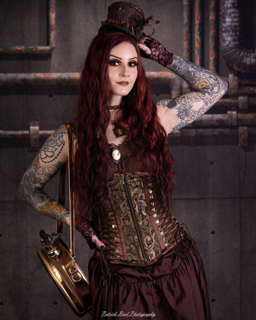 Portrait of a steampunk model named Minerva, taken on July 9, 2025. She is dressed in vintage-inspired futuristic attire with detailed accessories, capturing the essence of steampunk fashion.