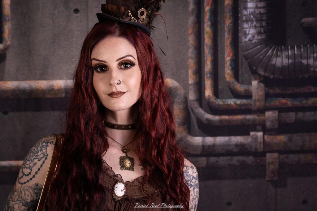 Portrait of a steampunk model named Minerva, taken on July 9, 2025. She is dressed in vintage-inspired futuristic attire with detailed accessories, capturing the essence of steampunk fashion.