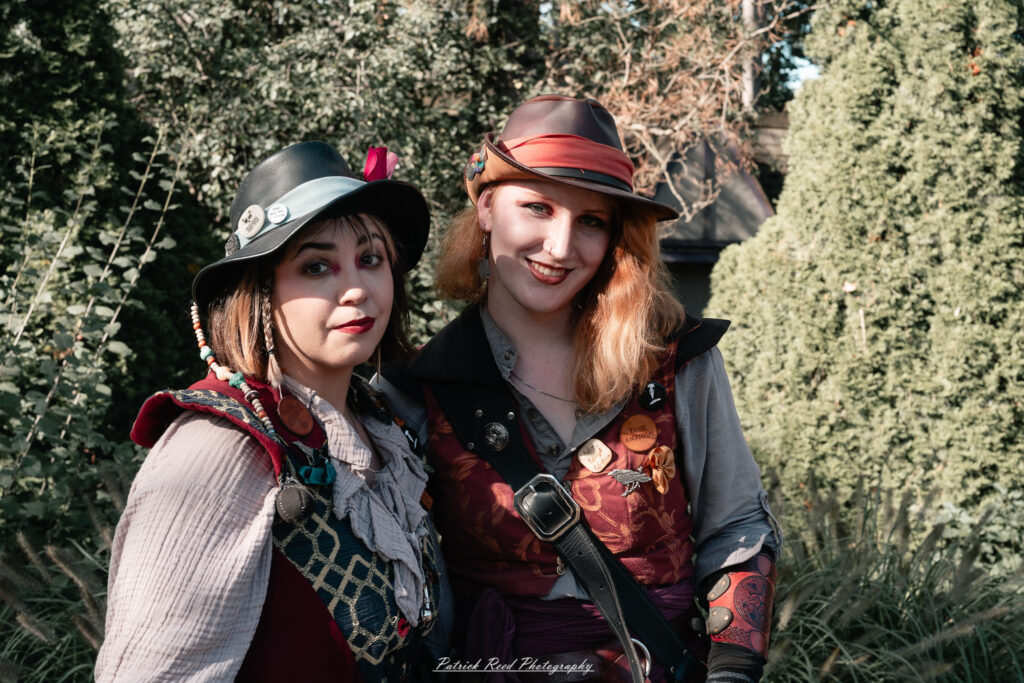 A costumed performer at the Michigan Renaissance Festival 2025, wearing traditional Renaissance attire during a live event in Holly, Michigan.