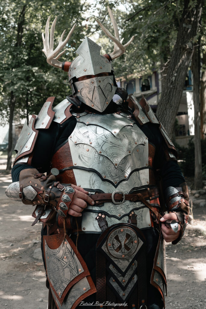 A costumed performer at the Michigan Renaissance Festival 2025, wearing traditional Renaissance attire during a live event in Holly, Michigan.