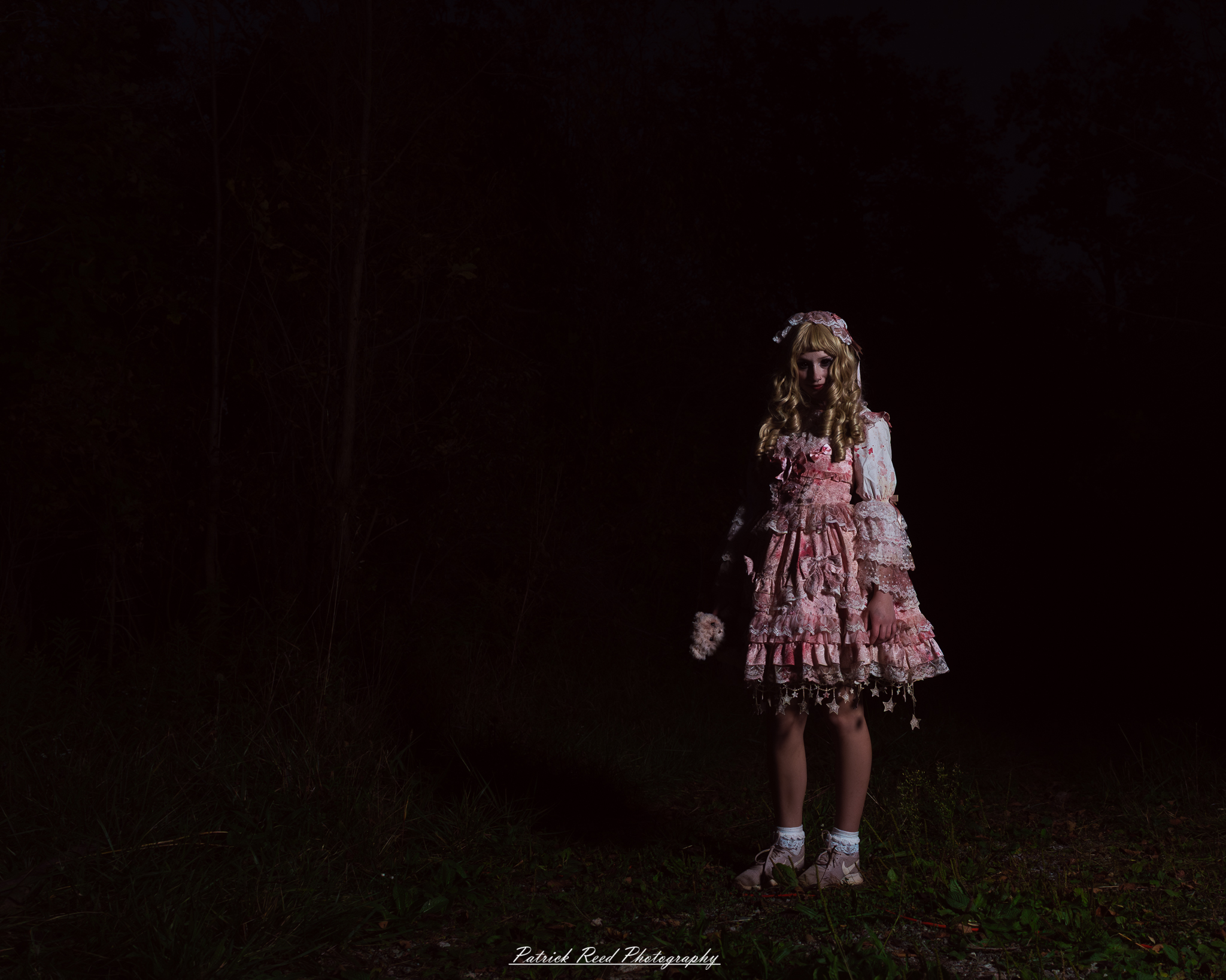Spooky night photography at Scarefest Haunted Park in Michigan, featuring eerie lighting, haunted attractions, and Halloween-themed performers.