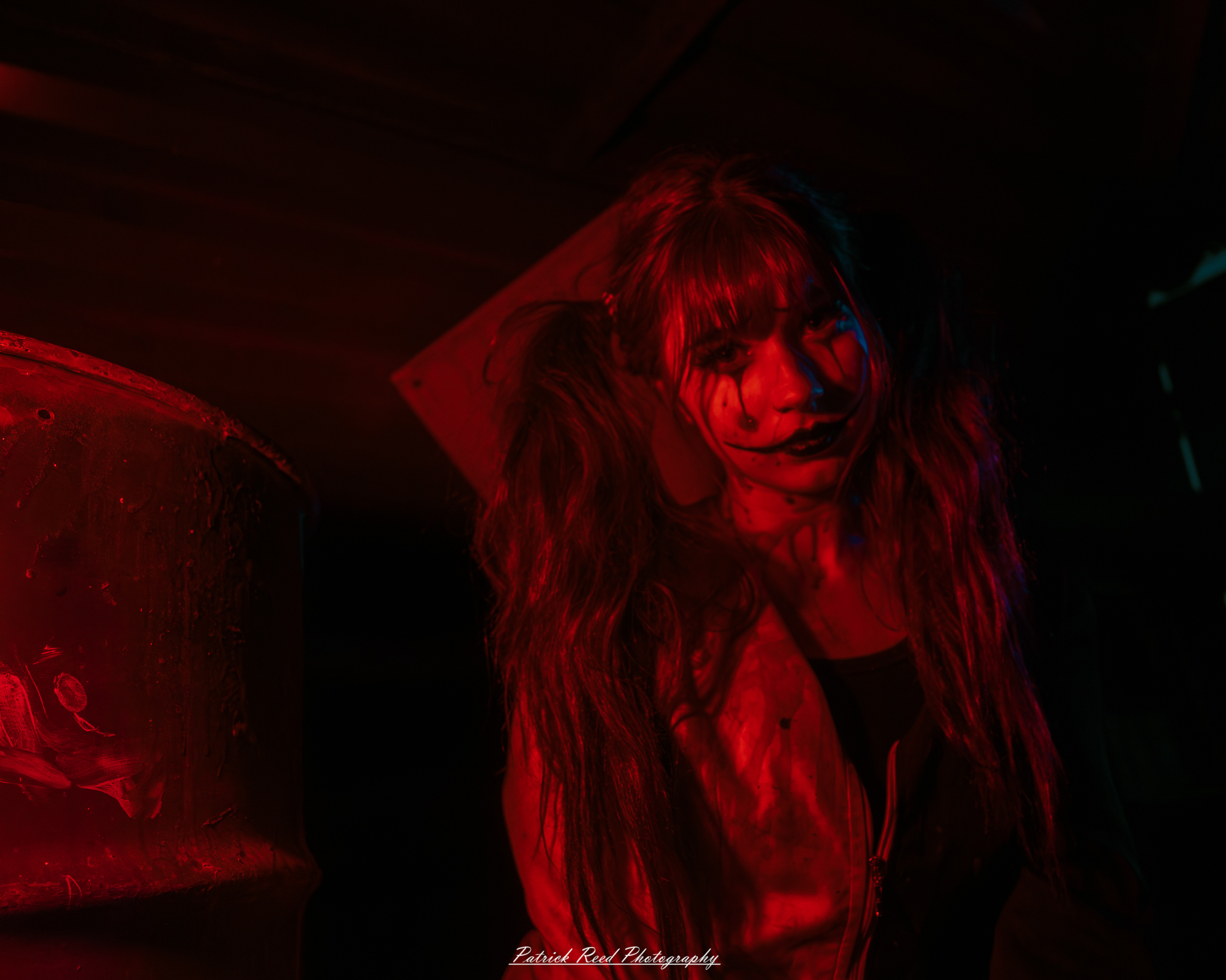 Spooky night photography at Scarefest Haunted Park in Michigan, featuring eerie lighting, haunted attractions, and Halloween-themed performers.