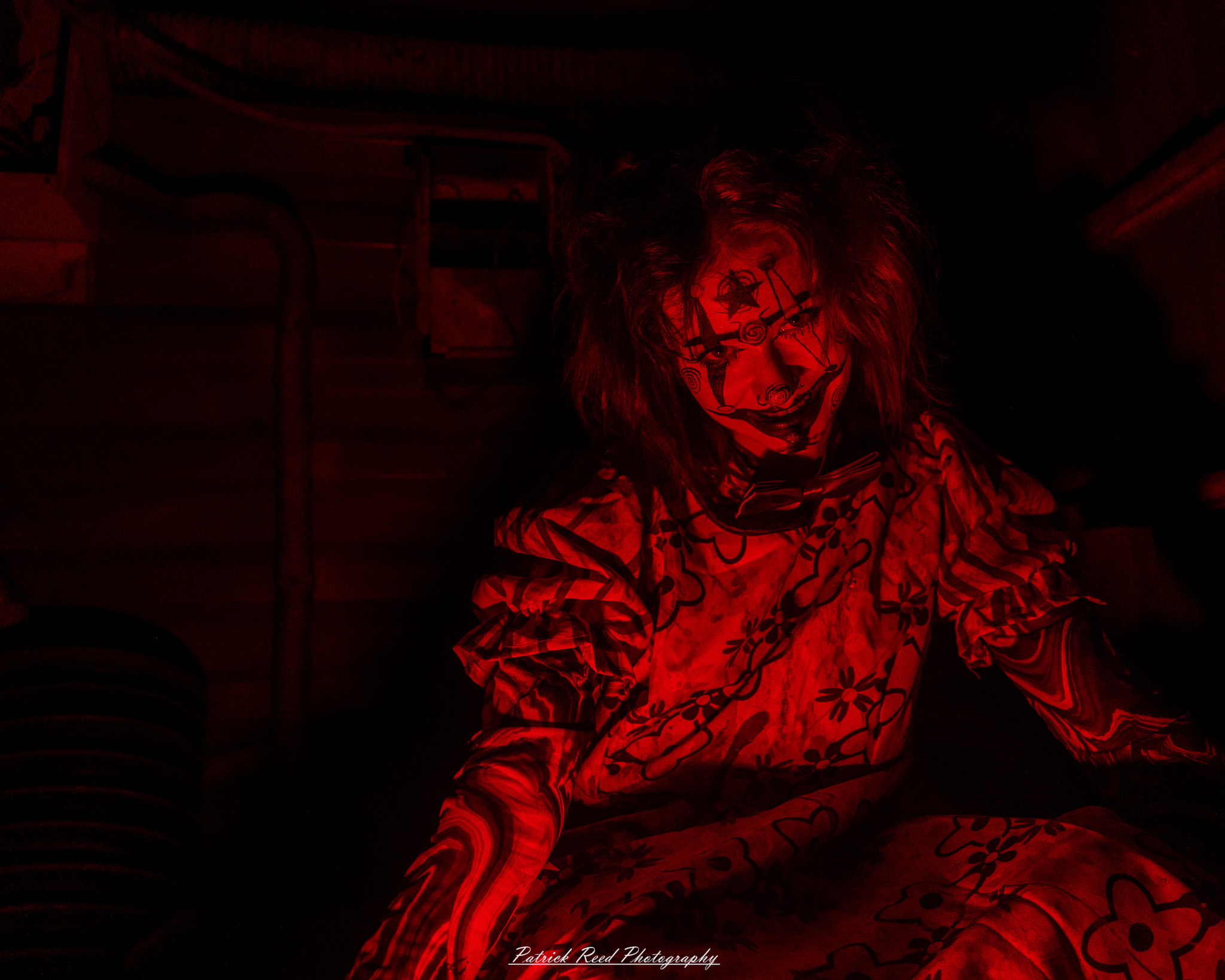 Spooky night photography at Scarefest Haunted Park in Michigan, featuring eerie lighting, haunted attractions, and Halloween-themed performers.