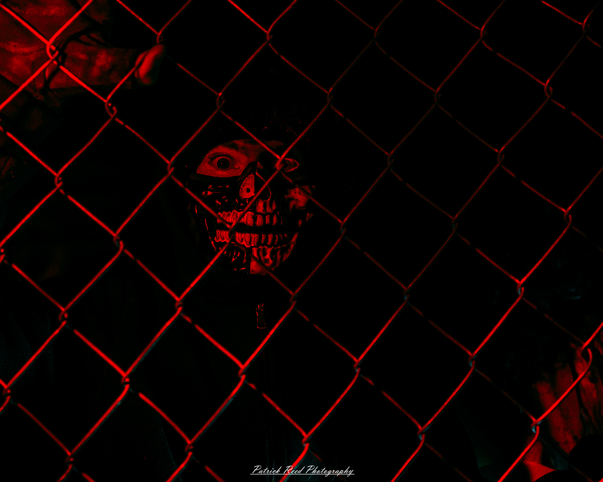 Spooky night photography at Scarefest Haunted Park in Michigan, featuring eerie lighting, haunted attractions, and Halloween-themed performers.