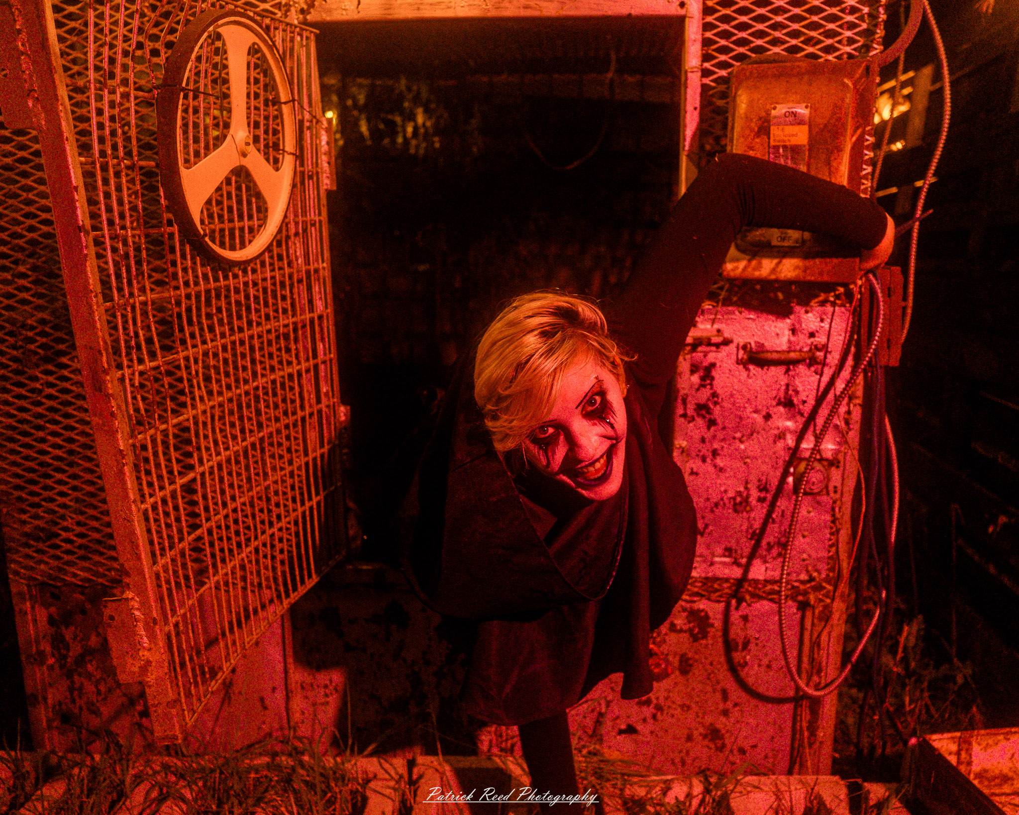 Spooky night photography at Scarefest Haunted Park in Michigan, featuring eerie lighting, haunted attractions, and Halloween-themed performers.