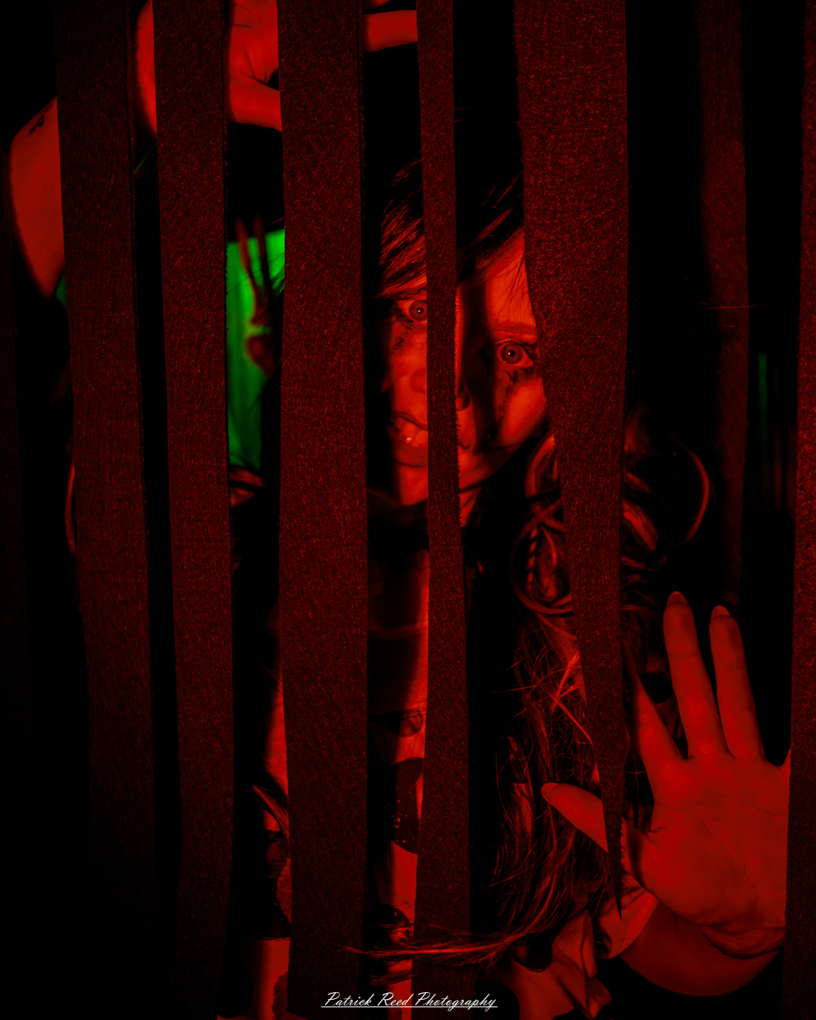 Spooky night photography at Scarefest Haunted Park in Michigan, featuring eerie lighting, haunted attractions, and Halloween-themed performers.