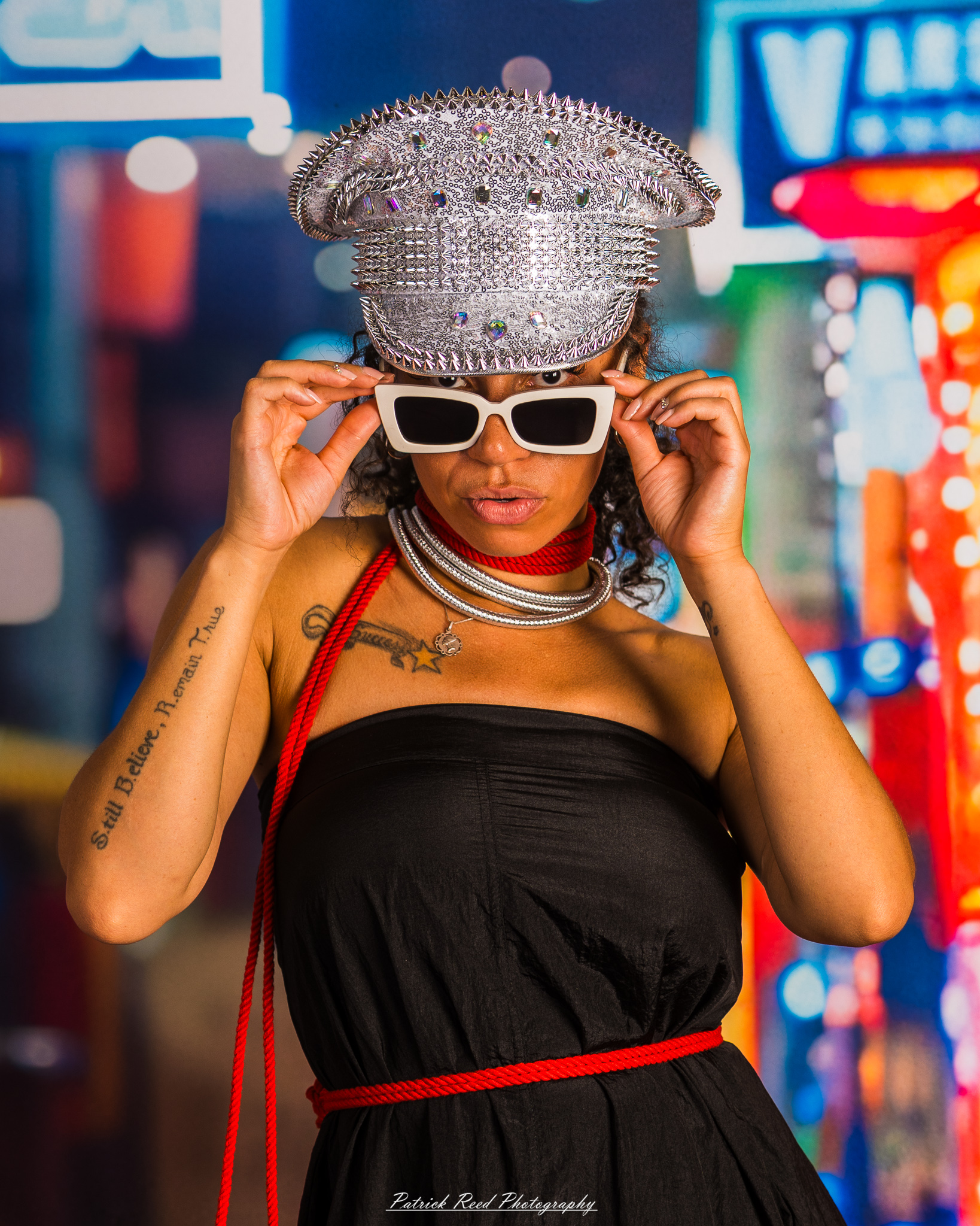 A portrait of a model named Sigh Bleu, photographed on September 24, 2025, featuring expressive posing and dramatic lighting in a studio setting.