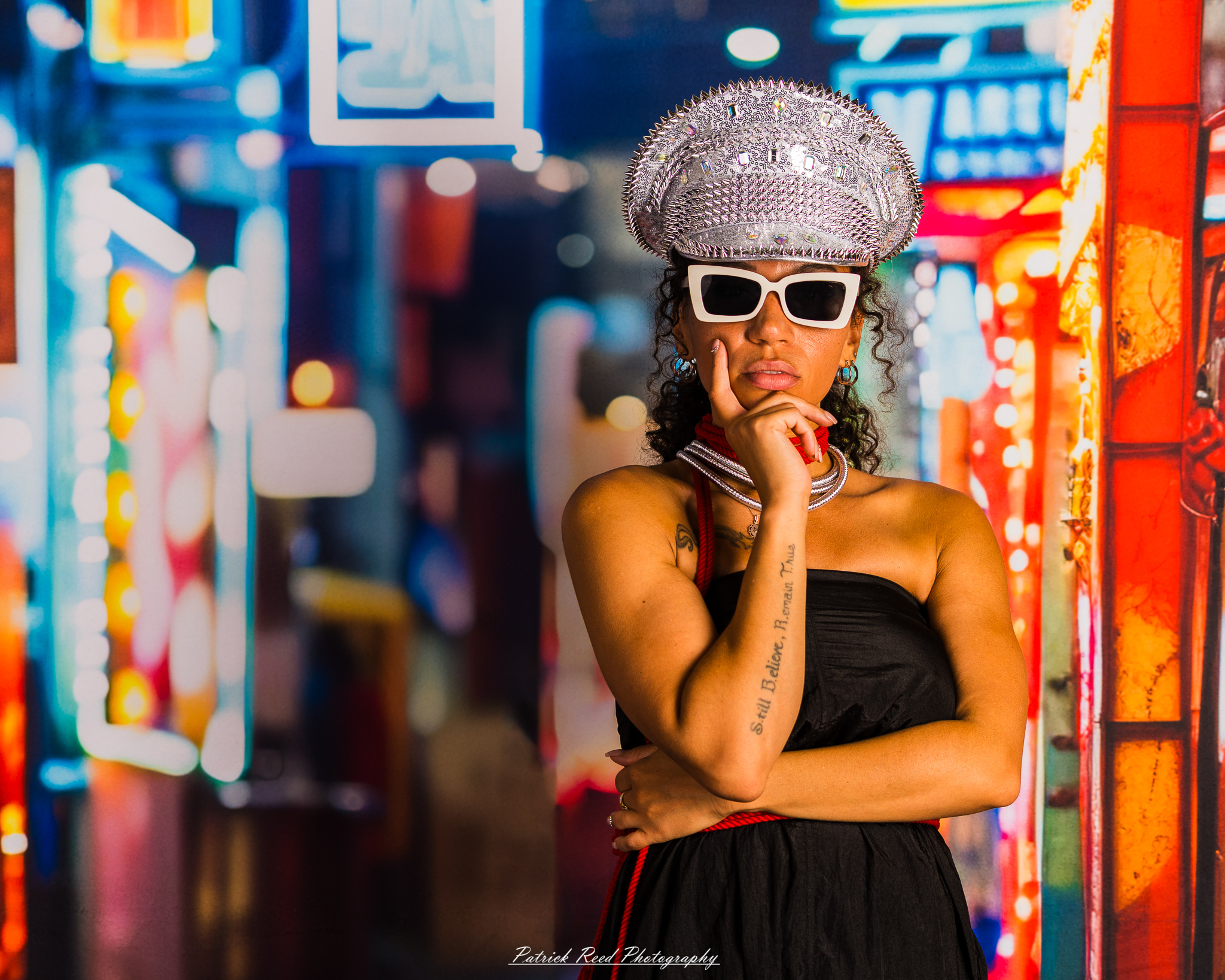 A portrait of a model named Sigh Bleu, photographed on September 24, 2025, featuring expressive posing and dramatic lighting in a studio setting.
