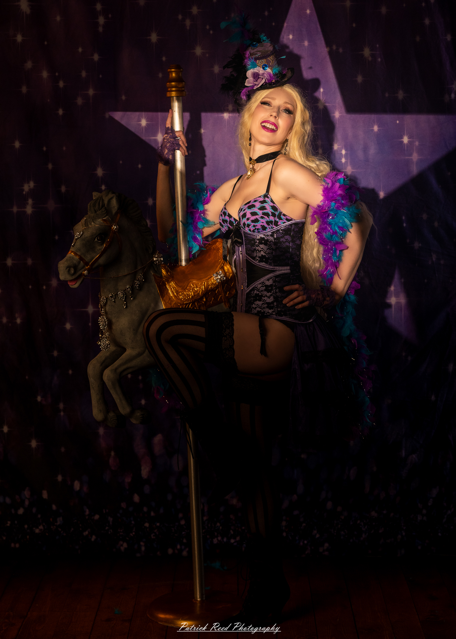 A cabaret-themed portrait featuring dramatic stage-inspired lighting, bold styling, and theatrical atmosphere. The image captures vintage glamour with a moody, performance-driven aesthetic.