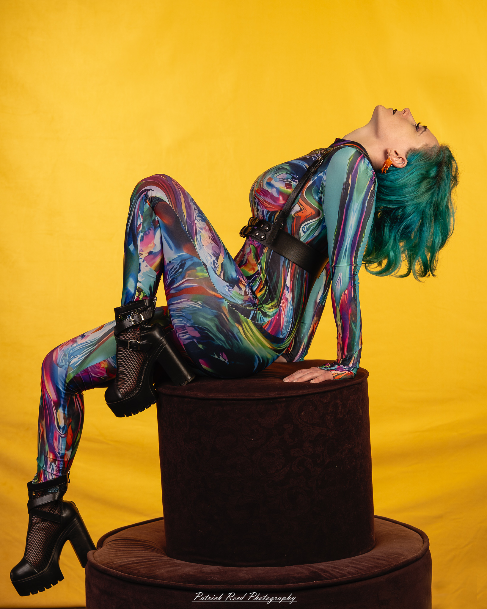 A fantasy-inspired portrait titled “Enchanted Valkyrie,” photographed on February 18, 2026. The model is styled in ethereal costume with dramatic lighting, evoking a powerful, otherworldly presence.