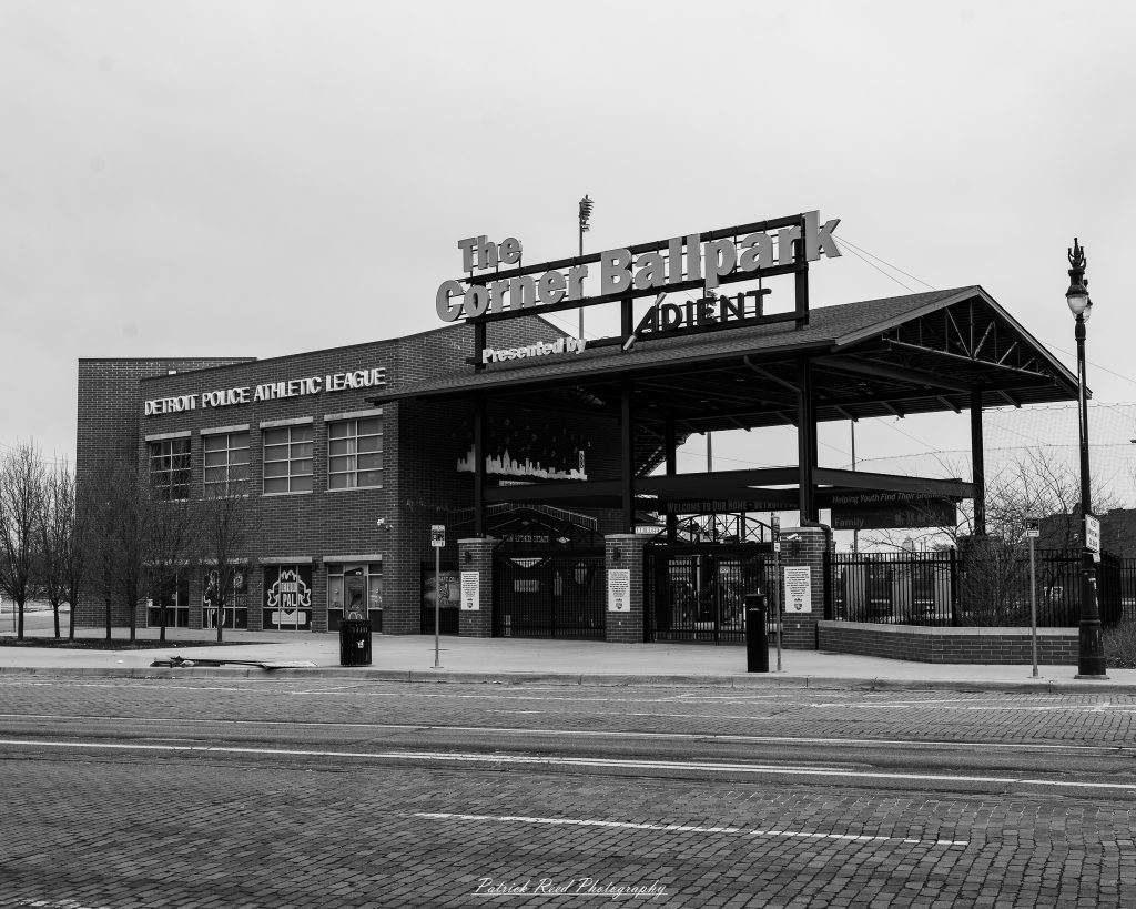 Black and white street photography in downtown Detroit, Michigan capturing urban architecture, city life, public art, and Detroit riverfront scenes in a documentary photography style.