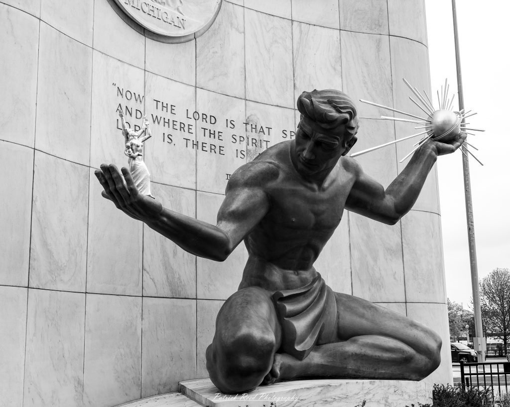 Black and white street photography in downtown Detroit, Michigan capturing urban architecture, city life, public art, and Detroit riverfront scenes in a documentary photography style.