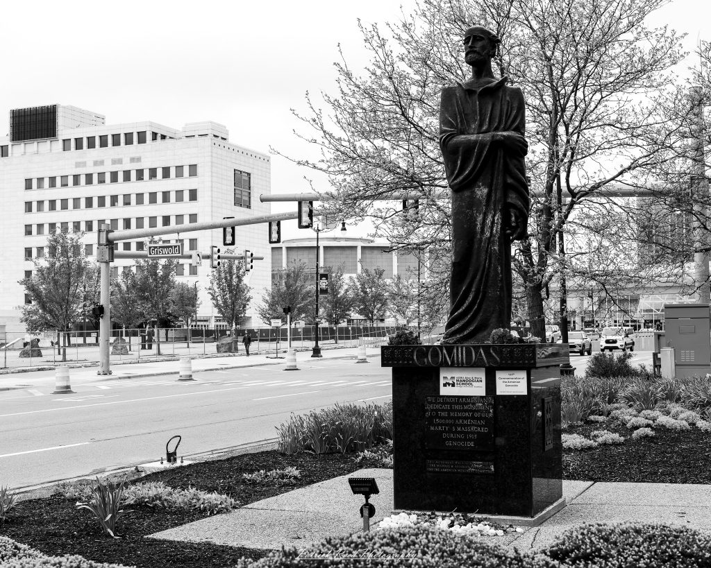 Black and white street photography in downtown Detroit, Michigan capturing urban architecture, city life, public art, and Detroit riverfront scenes in a documentary photography style.