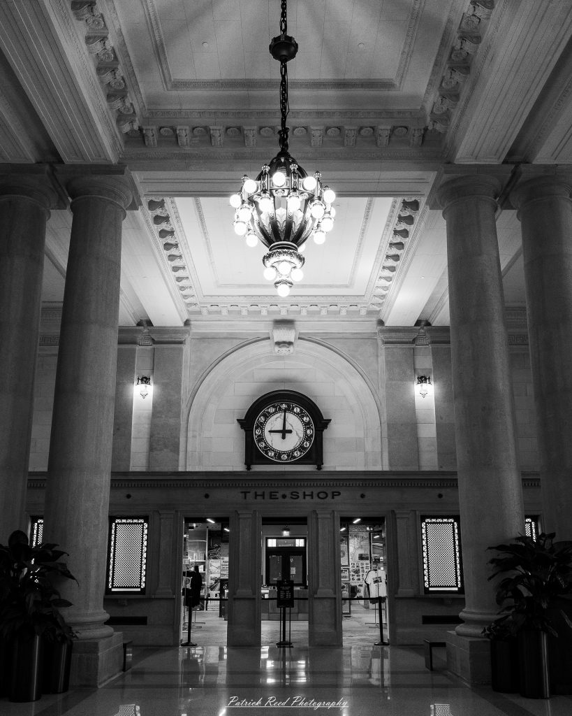 Black and white street photography in downtown Detroit, Michigan capturing urban architecture, city life, public art, and Detroit riverfront scenes in a documentary photography style.