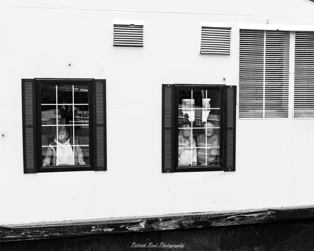 Black and white street photography in downtown Detroit, Michigan capturing urban architecture, city life, public art, and Detroit riverfront scenes in a documentary photography style.