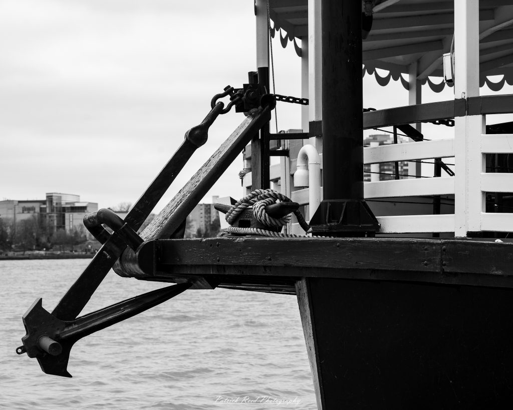 Black and white street photography in downtown Detroit, Michigan capturing urban architecture, city life, public art, and Detroit riverfront scenes in a documentary photography style.