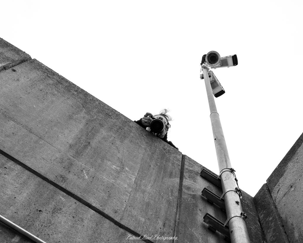 Black and white street photography in downtown Detroit, Michigan capturing urban architecture, city life, public art, and Detroit riverfront scenes in a documentary photography style.