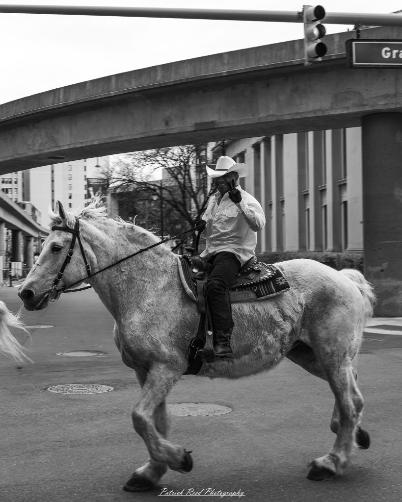Black and white street photography in downtown Detroit, Michigan capturing urban architecture, city life, public art, and Detroit riverfront scenes in a documentary photography style.