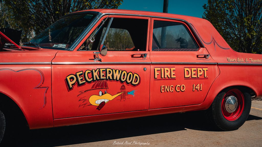Classic car photography from a Michigan car show featuring vintage muscle cars, hot rods, classic trucks, and automotive detail shots captured in a cinematic documentary style.