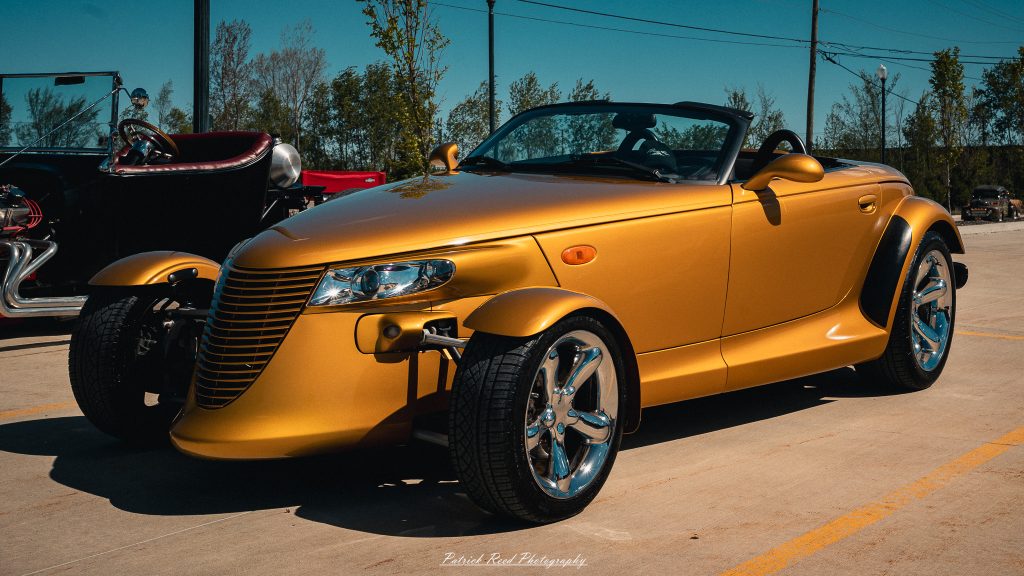 Classic car photography from a Michigan car show featuring vintage muscle cars, hot rods, classic trucks, and automotive detail shots captured in a cinematic documentary style.
