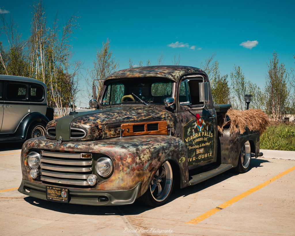 Classic car photography from a Michigan car show featuring vintage muscle cars, hot rods, classic trucks, and automotive detail shots captured in a cinematic documentary style.