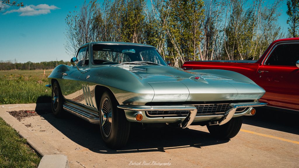 Classic car photography from a Michigan car show featuring vintage muscle cars, hot rods, classic trucks, and automotive detail shots captured in a cinematic documentary style.