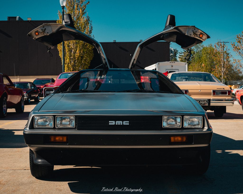Classic car photography from a Michigan car show featuring vintage muscle cars, hot rods, classic trucks, and automotive detail shots captured in a cinematic documentary style.