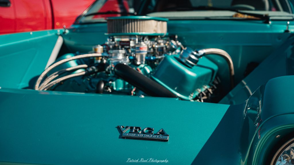 Classic car photography from a Michigan car show featuring vintage muscle cars, hot rods, classic trucks, and automotive detail shots captured in a cinematic documentary style.