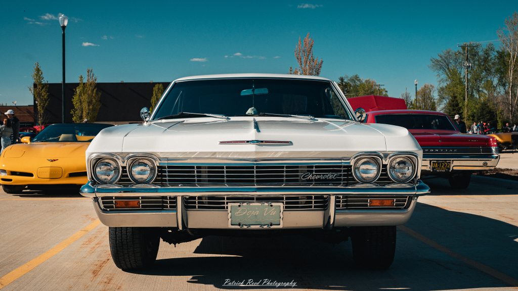 Classic car photography from a Michigan car show featuring vintage muscle cars, hot rods, classic trucks, and automotive detail shots captured in a cinematic documentary style.