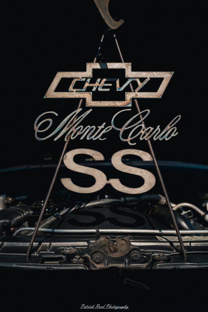 Classic car photography from a Michigan car show featuring vintage muscle cars, hot rods, classic trucks, and automotive detail shots captured in a cinematic documentary style.