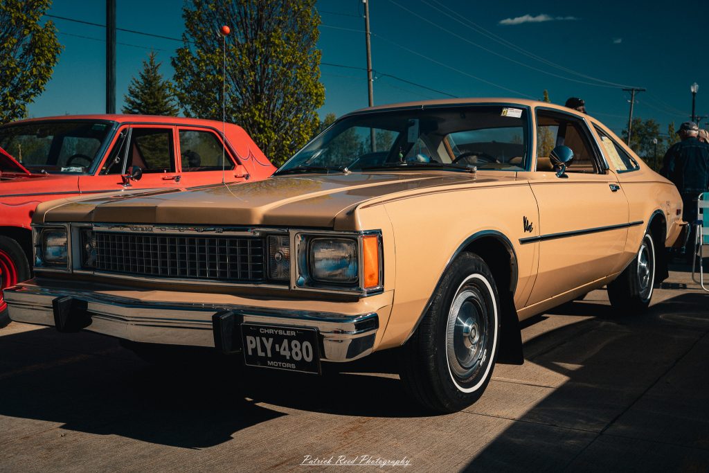 Classic car photography from a Michigan car show featuring vintage muscle cars, hot rods, classic trucks, and automotive detail shots captured in a cinematic documentary style.