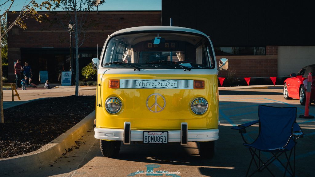 Classic car photography from a Michigan car show featuring vintage muscle cars, hot rods, classic trucks, and automotive detail shots captured in a cinematic documentary style.