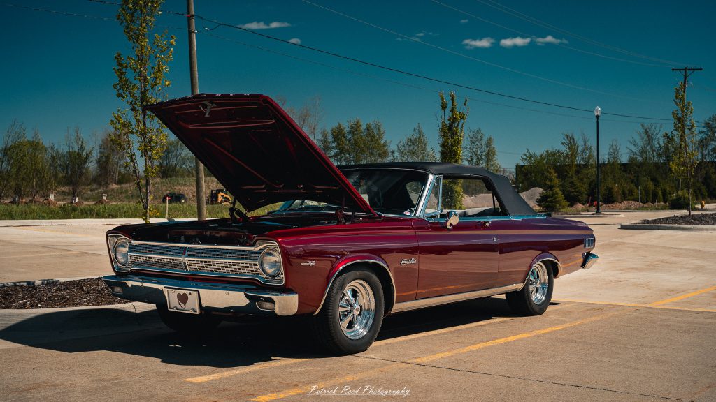 Classic car photography from a Michigan car show featuring vintage muscle cars, hot rods, classic trucks, and automotive detail shots captured in a cinematic documentary style.