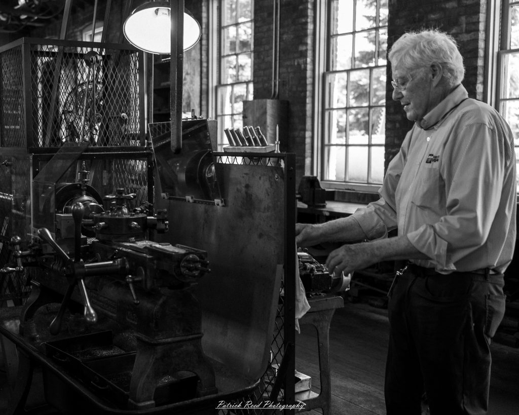 Photographs from Greenfield Village in Dearborn, Michigan, showcasing historic architecture, vintage vehicles, working trades, and cultural landmarks through documentary and street photography.