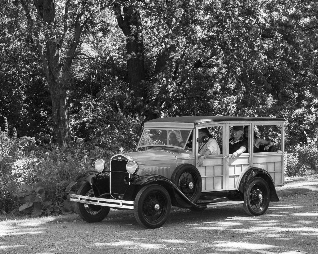 Photographs from Greenfield Village in Dearborn, Michigan, showcasing historic architecture, vintage vehicles, working trades, and cultural landmarks through documentary and street photography.